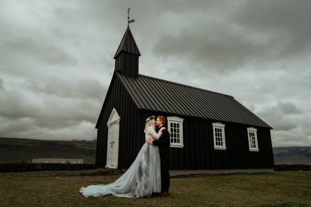 Couple kissing at the black church during their Iceland elopement