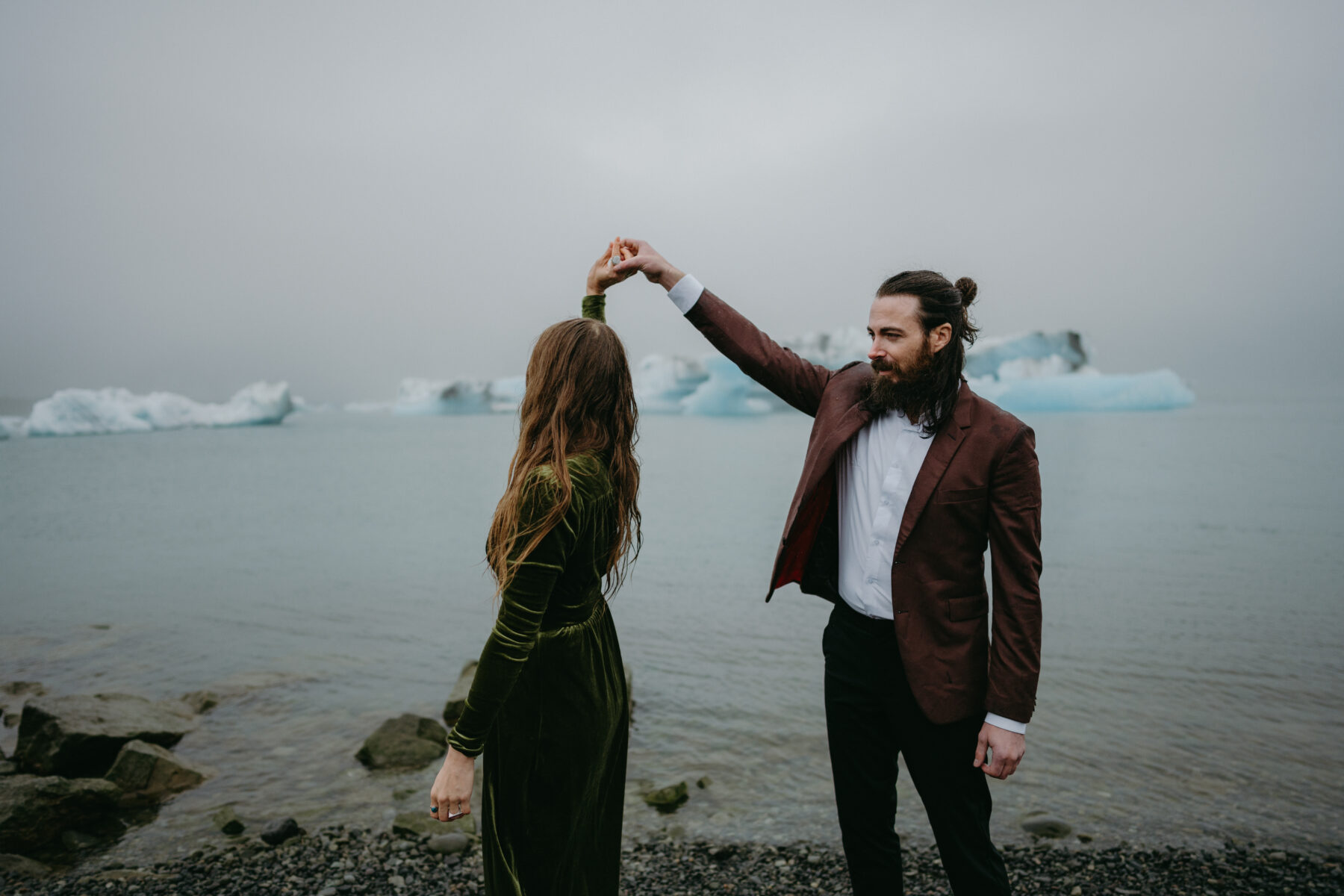 couple at jokulsarlon glacier lagoon for their iceland elopement